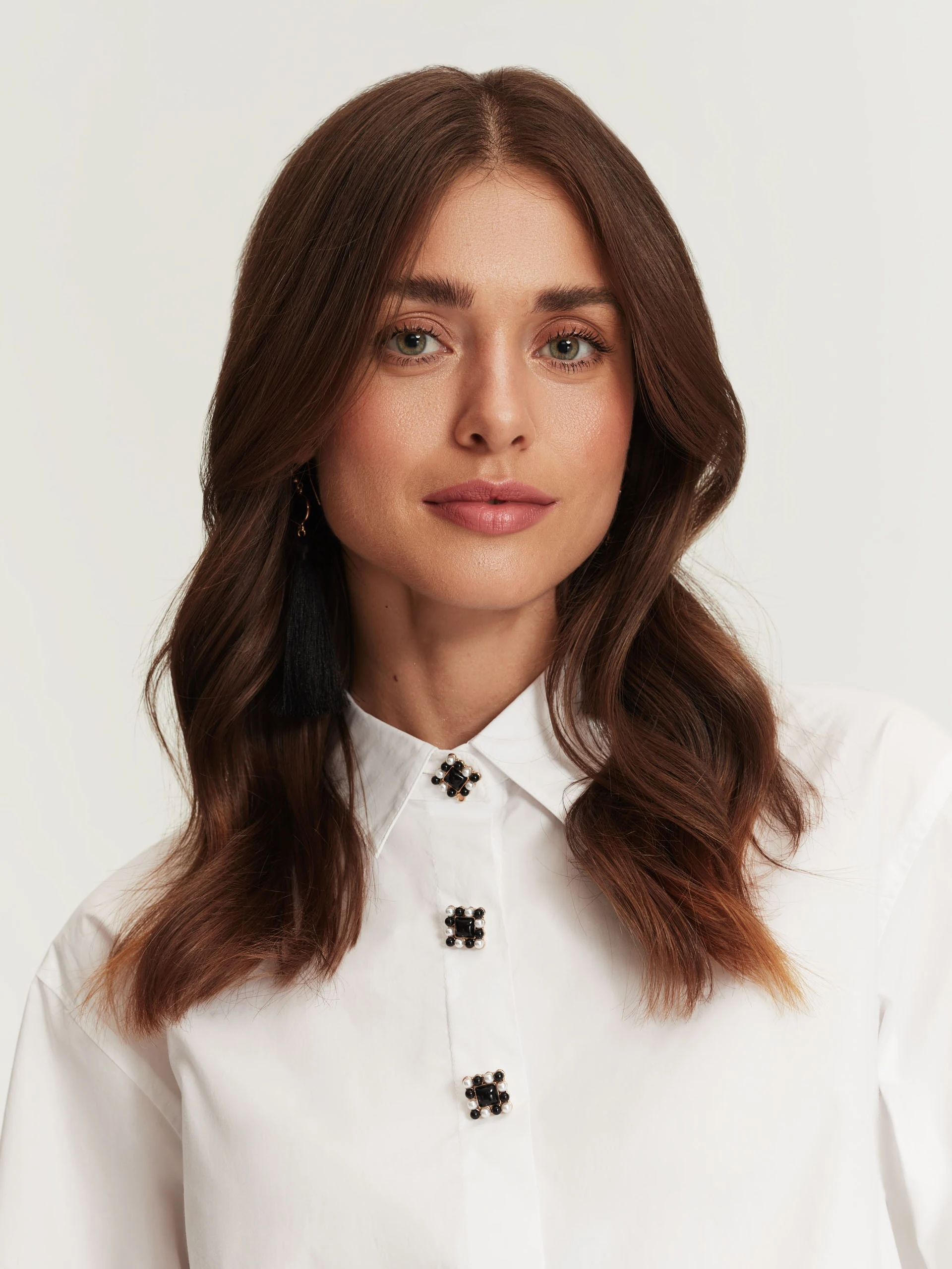 White shirt with decorative buttons