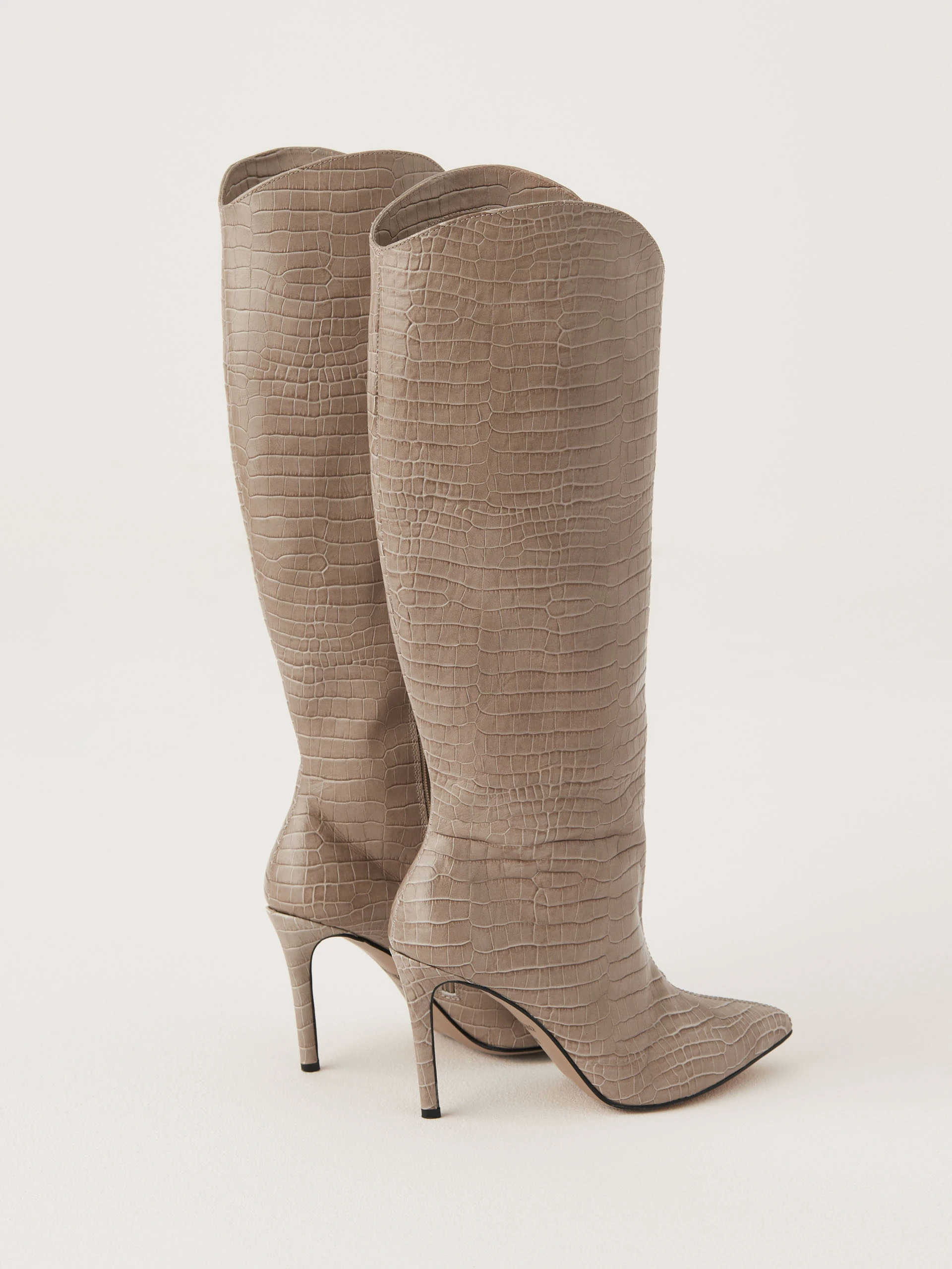 Beige stiletto heeled boots