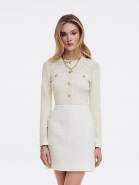 Sweater with openwork inserts and decorative buttons