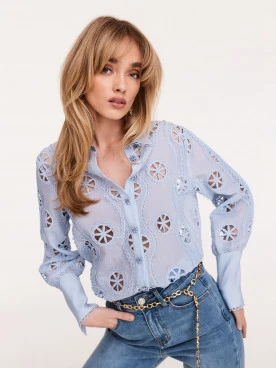 Blue shirt with daisy-shaped buttons
