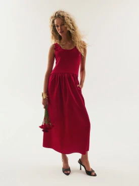 Red midi dress with decorative straps