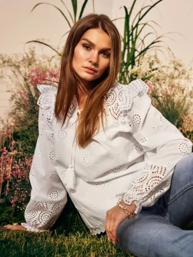 White blouse with openwork inserts