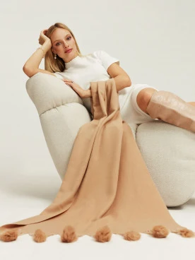 Beige shawl with pom-poms