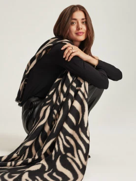 Beige shawl with animal pattern