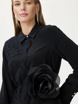 Black brooch with decorative flower