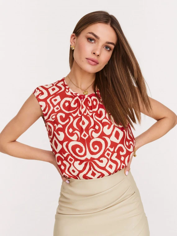 Red and white blouse with ornamental pattern