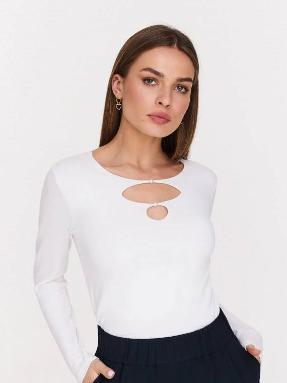 White blouse with striking cutouts