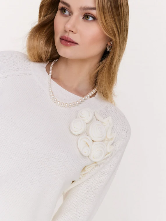 Cream sweater with rose embellishments