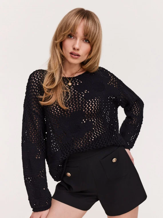 Openwork black sweater with floral elements