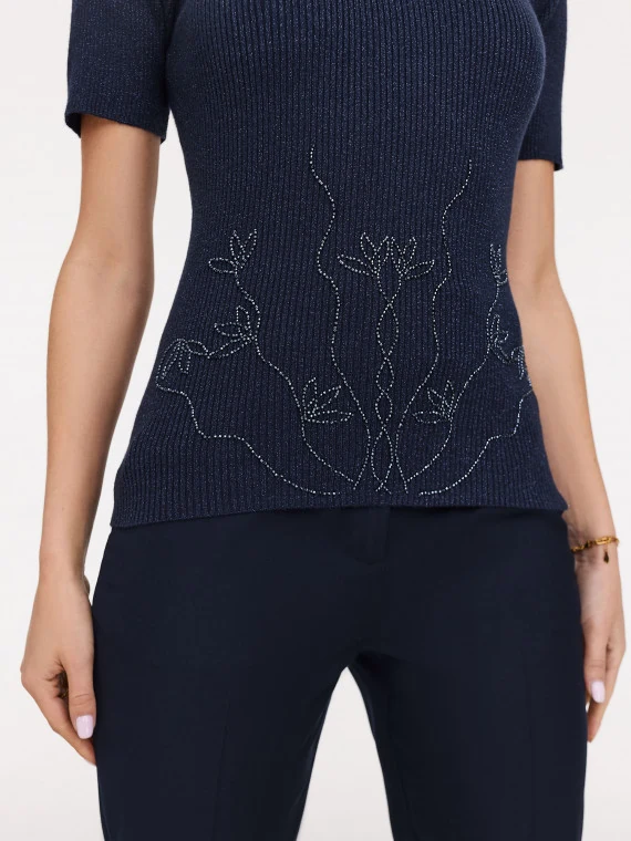 Navy blue sweater with floral appliqué
