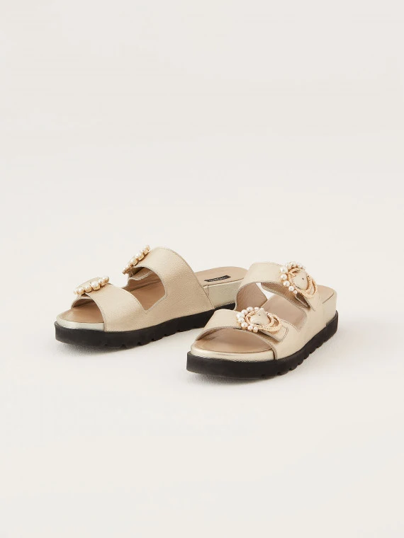 Flip-flops with decorative buckles in gold color