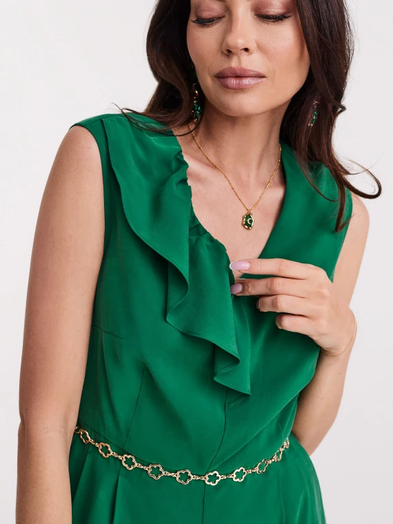 Gold colored necklace with green eyelet