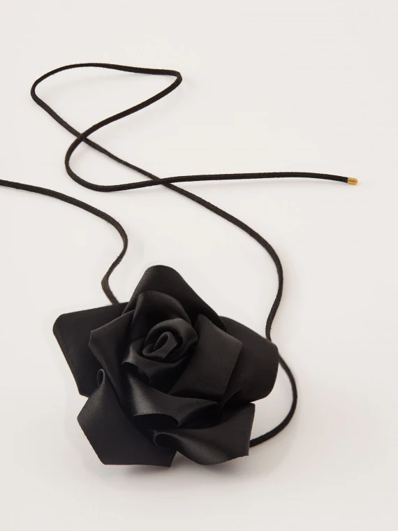 Black rose necklace on a thong