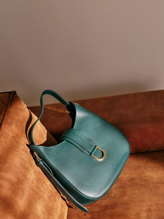 Green leather handbag with gold buckle