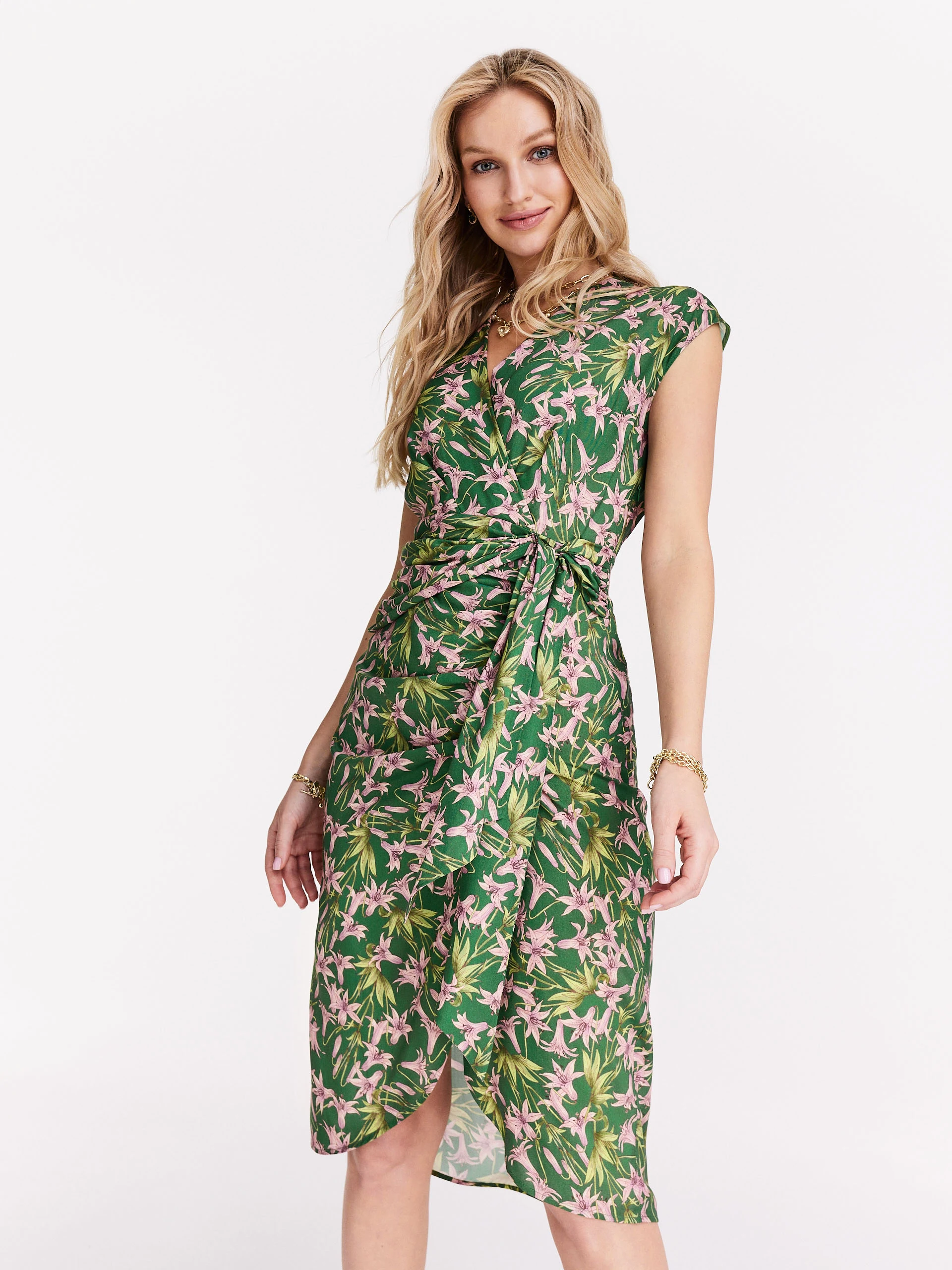 Asymmetrical green dress with exotic flowers