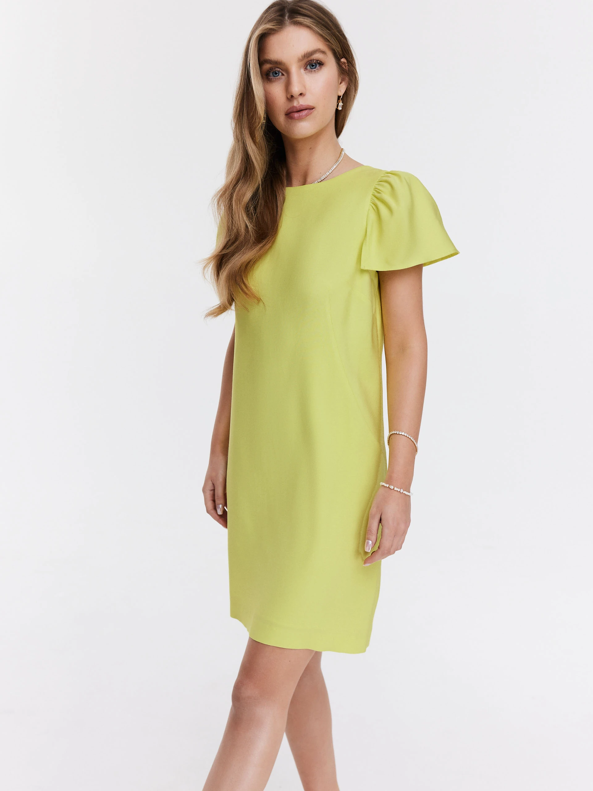 Simple lime green dress with buff sleeves