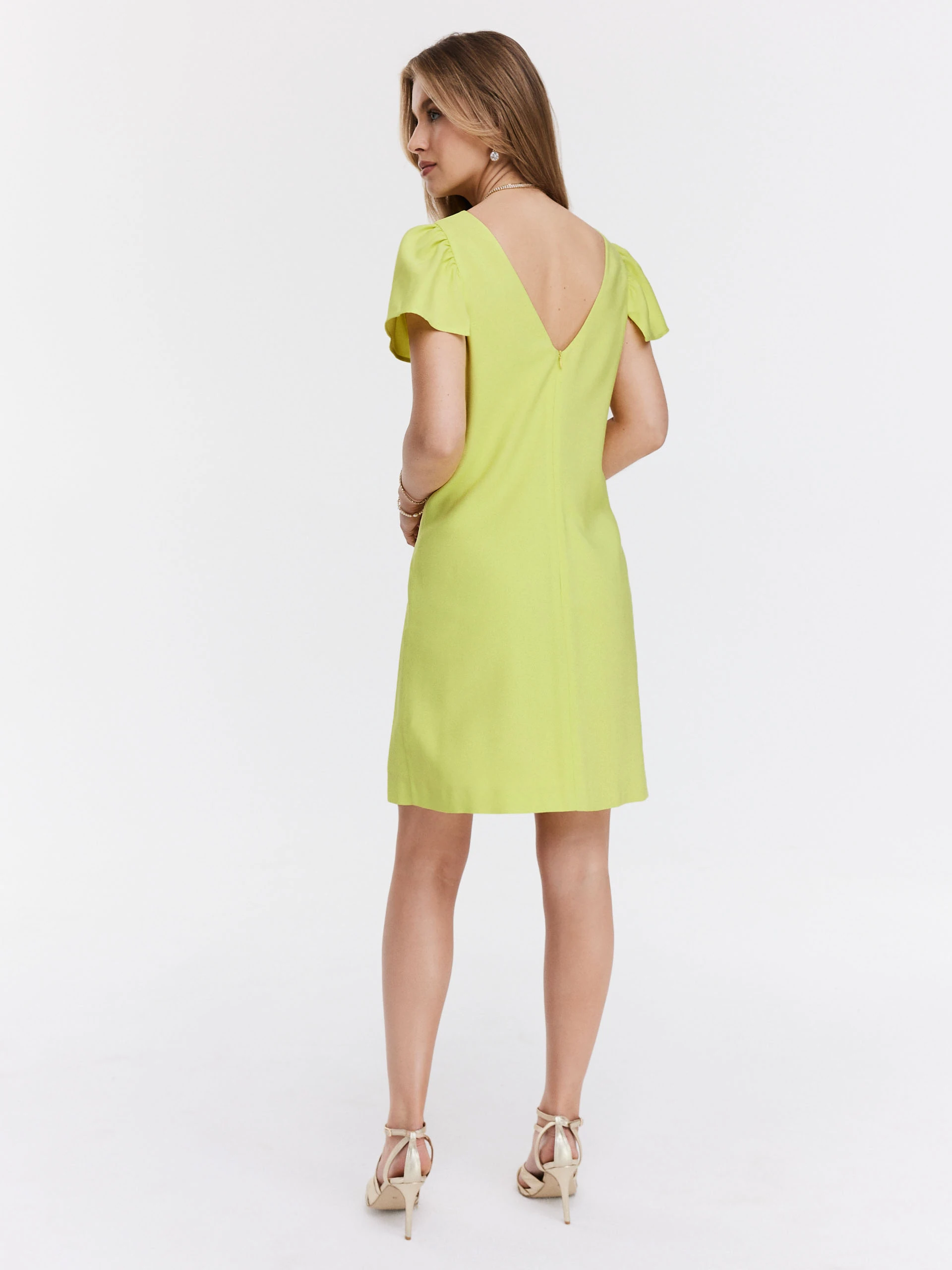 Simple lime green dress with buff sleeves