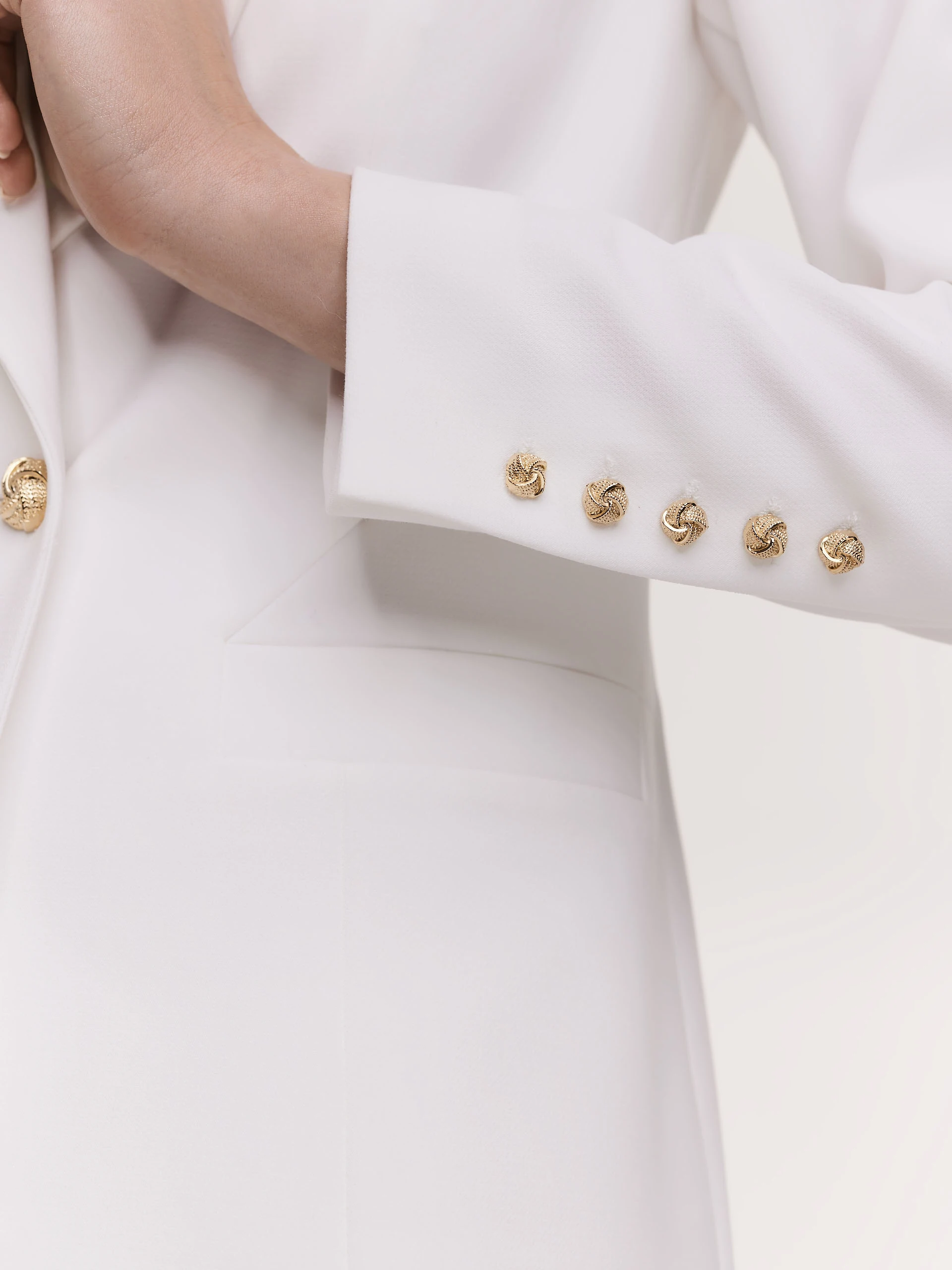 Elegant white jacket with decorative buttons