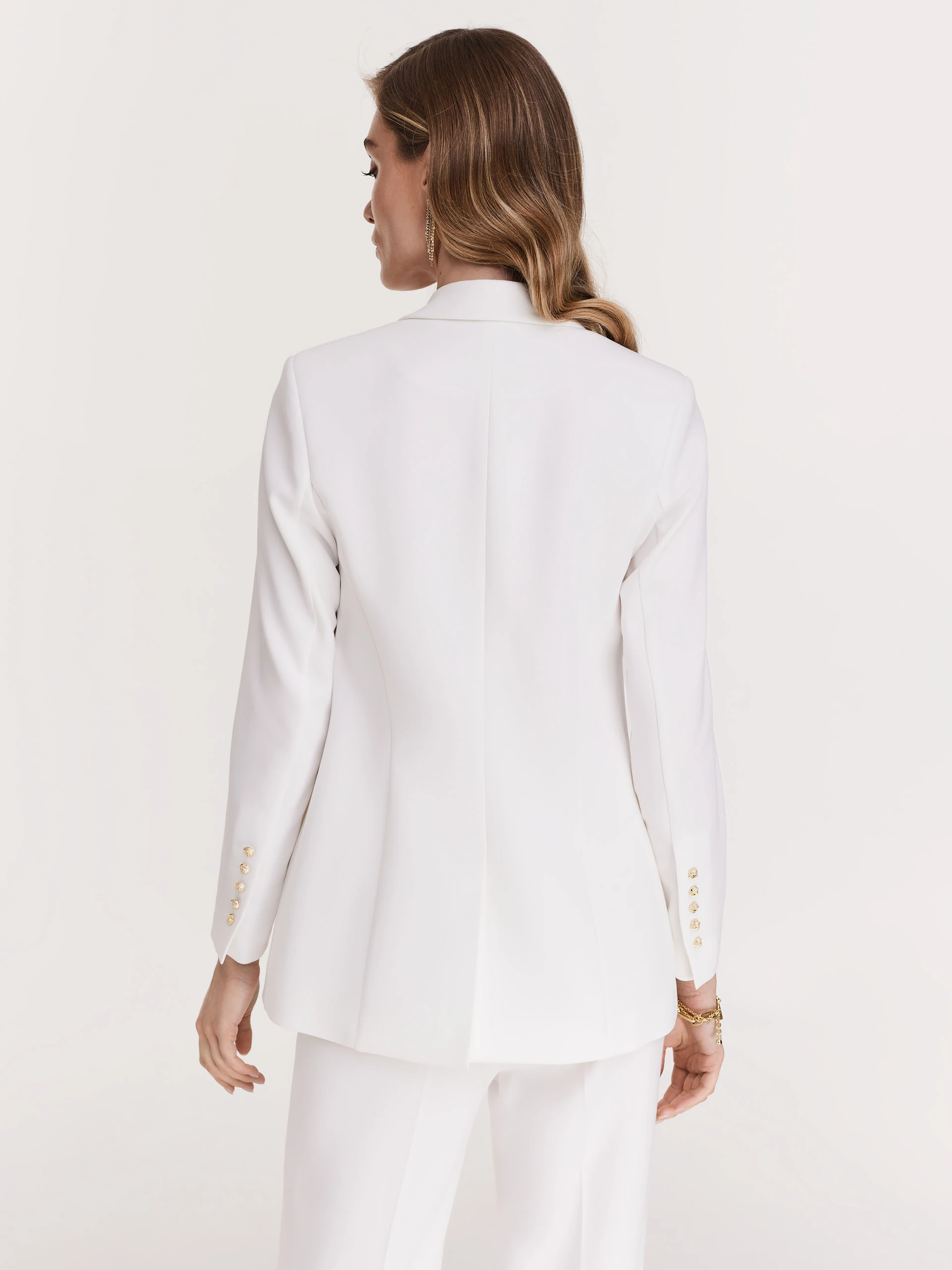 Elegant white jacket with decorative buttons