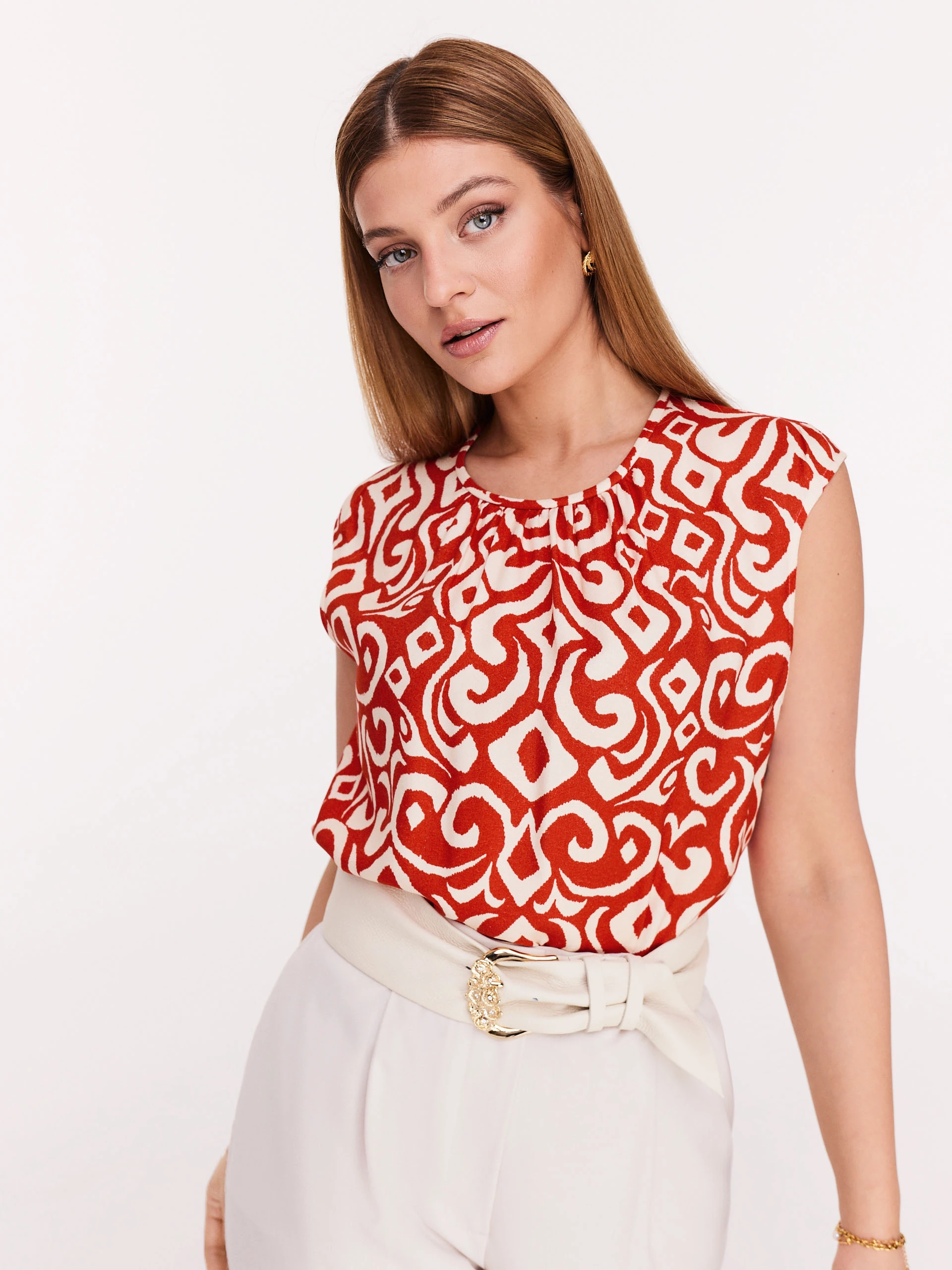 Red and white blouse with ornamental pattern