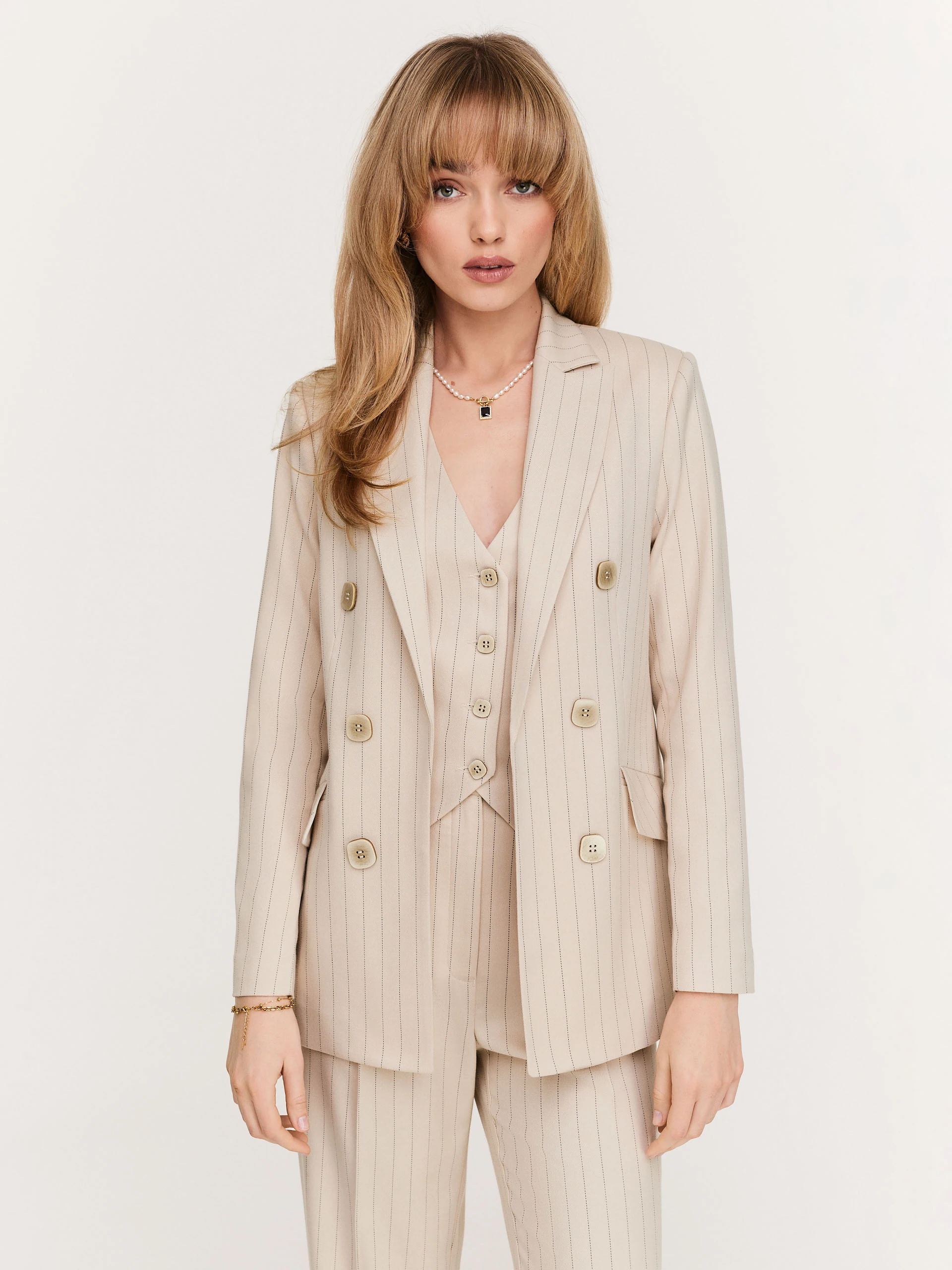 Beige double-breasted blazer in a delicate stripe pattern
