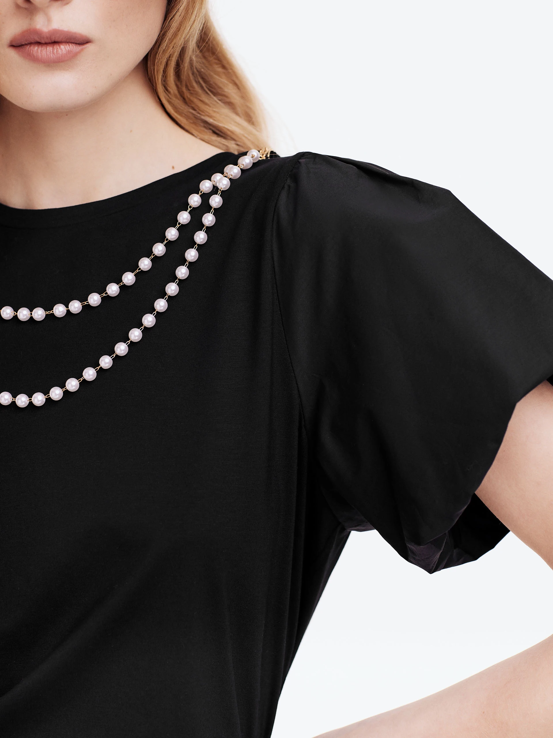 Black blouse with buff sleeves