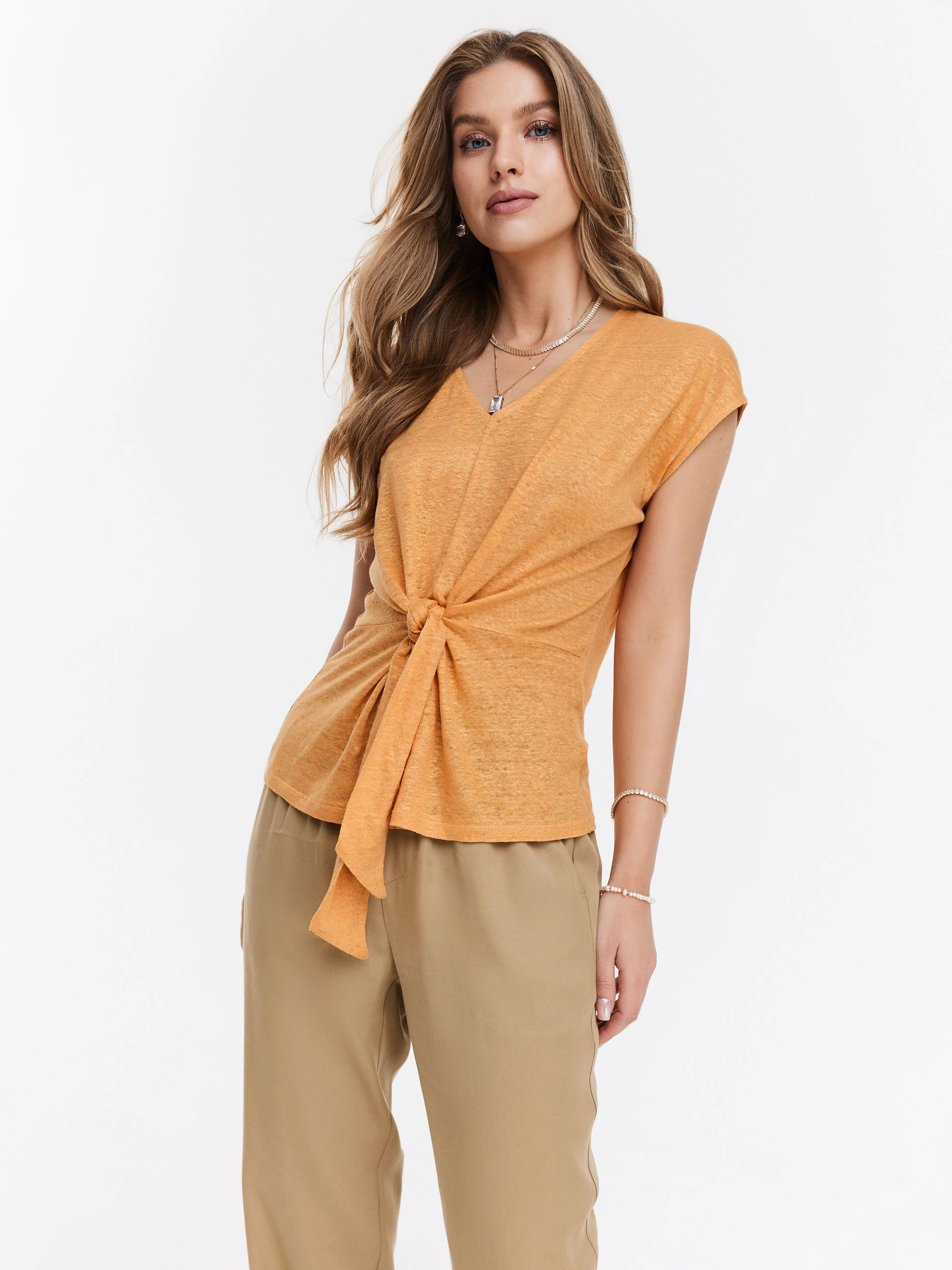 Orange linen blouse with shimmering threads