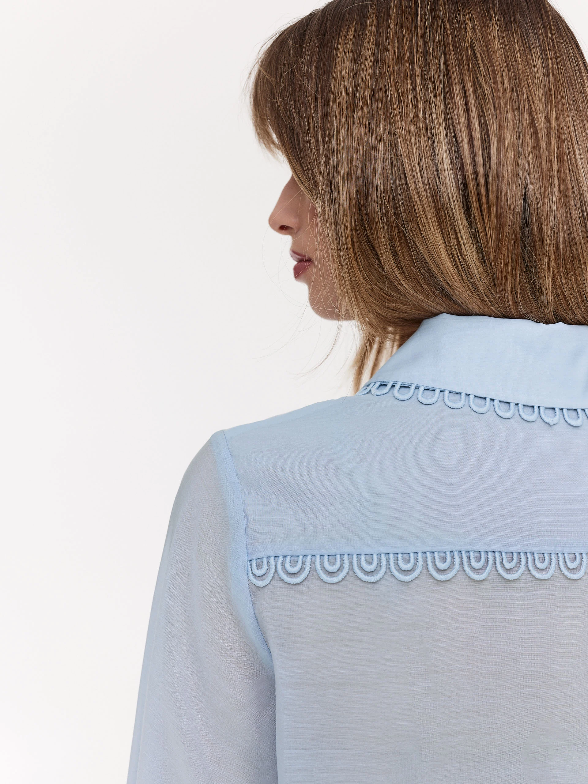 Blue shirt with decorative stitching