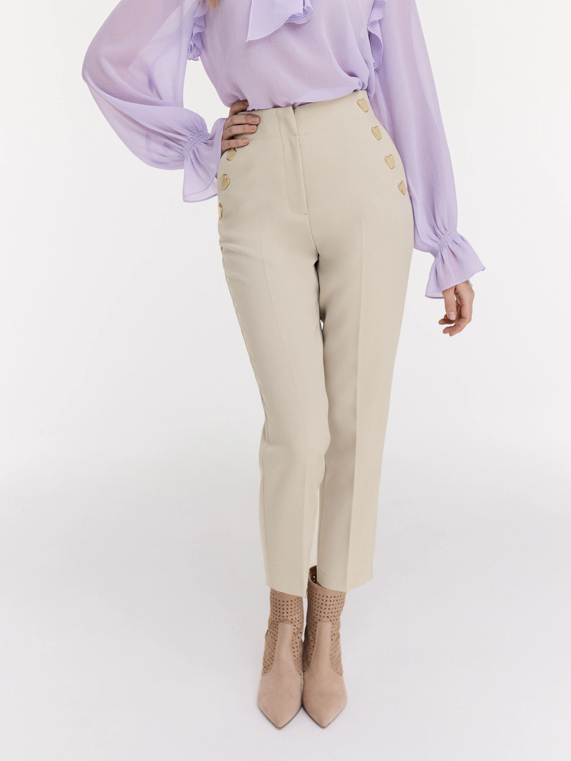 Beige cigarette pants with decorative buttons
