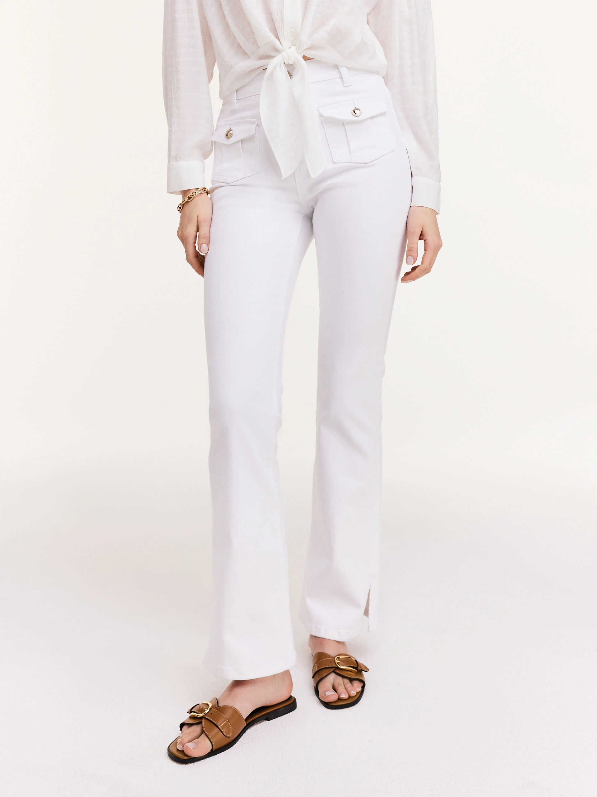 White pants with flared legs
