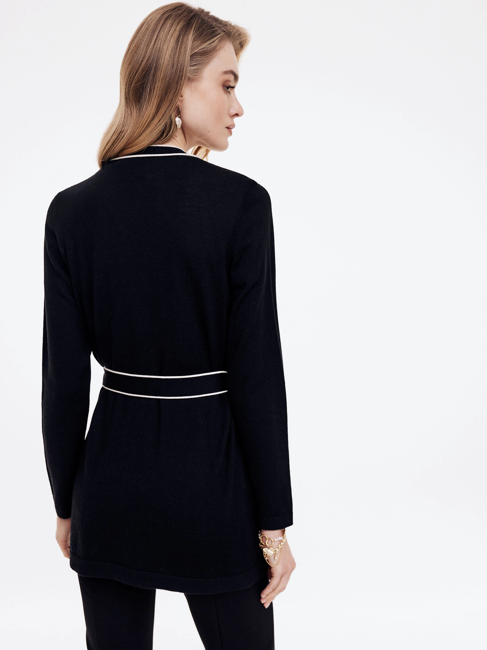 Black sweater with decorative buttons