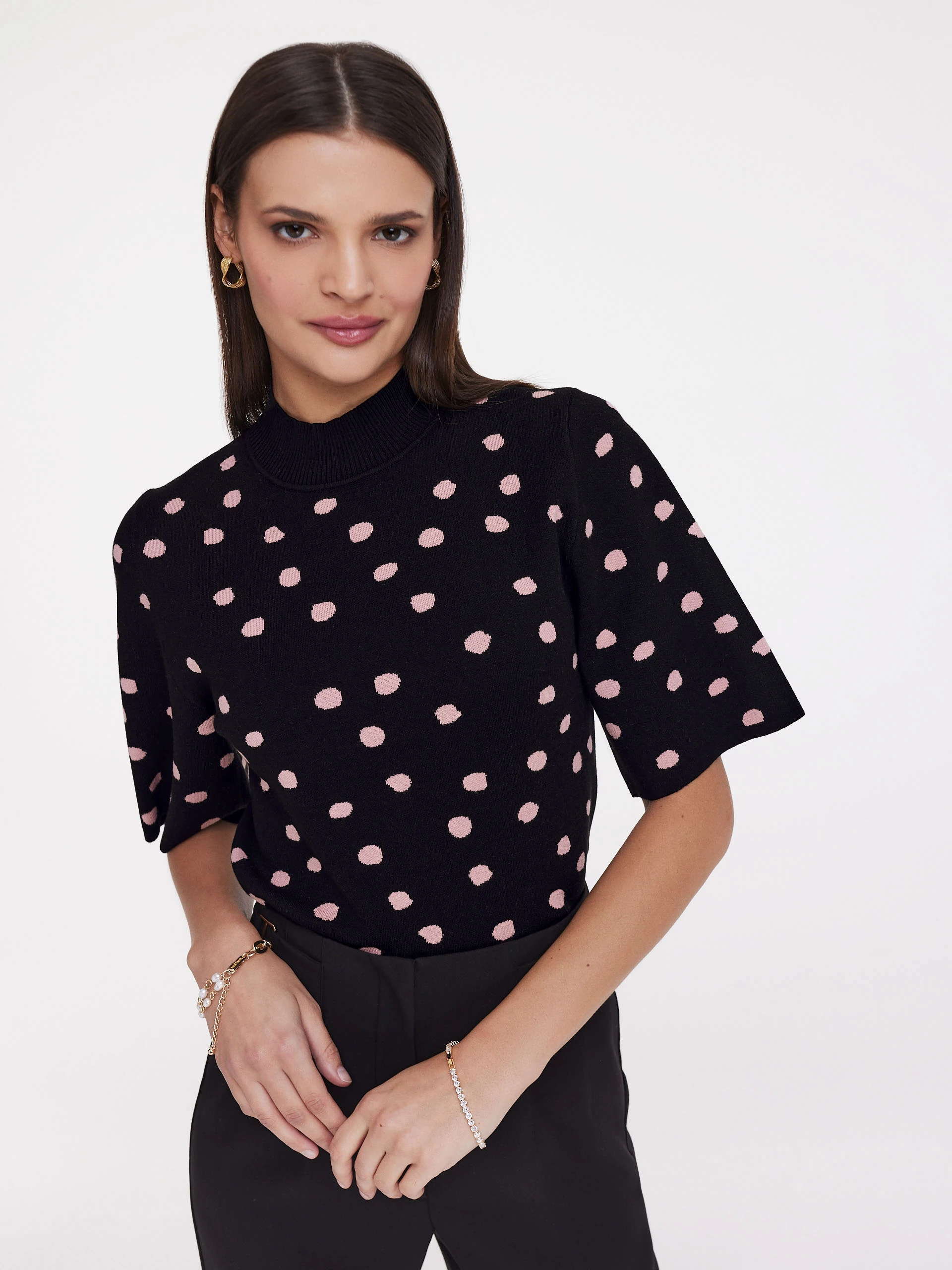 Black sweater with peas
