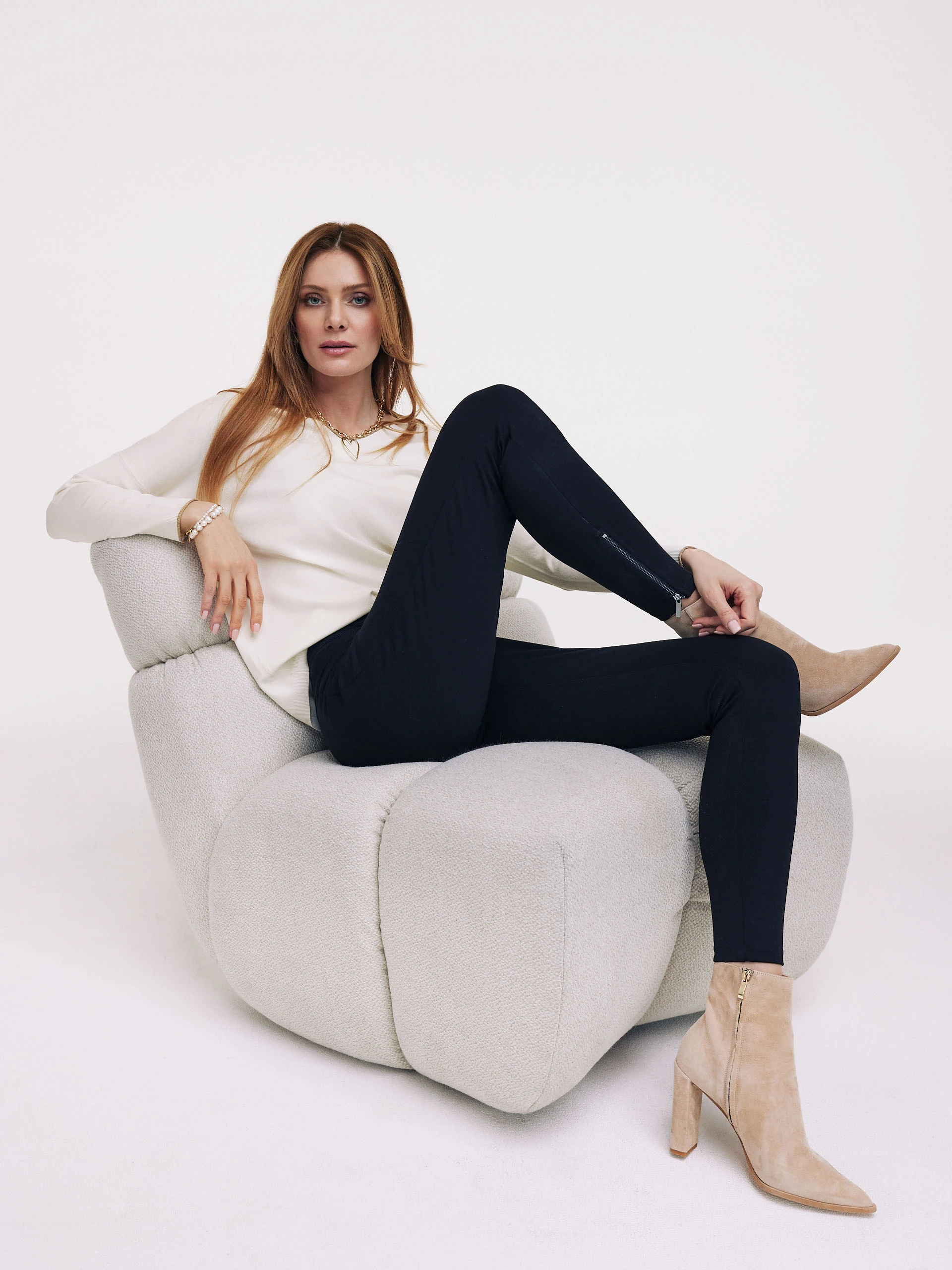 Thin white sweater with a heart neckline