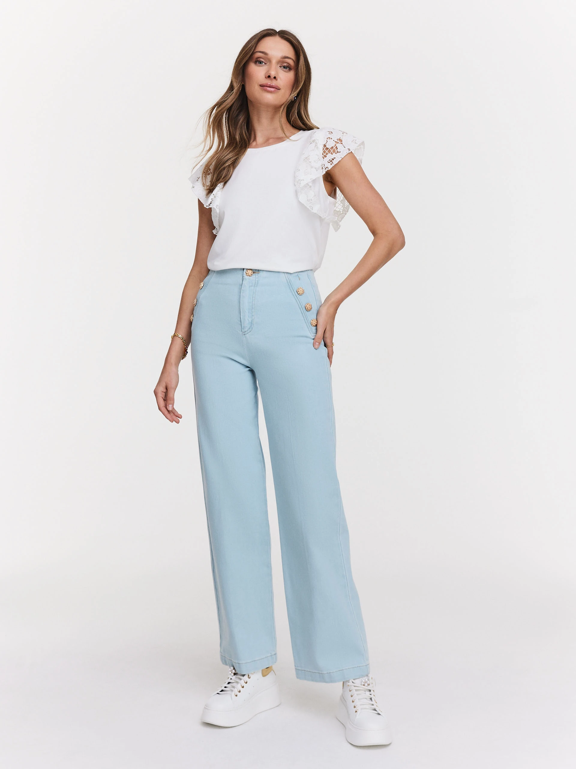 White blouse with embellished sleeves