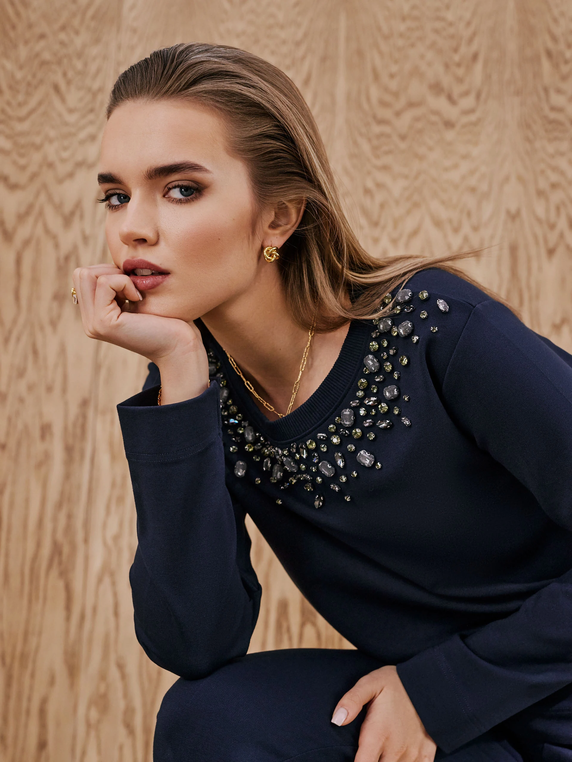 Navy blue sweatshirt decorated with crystals