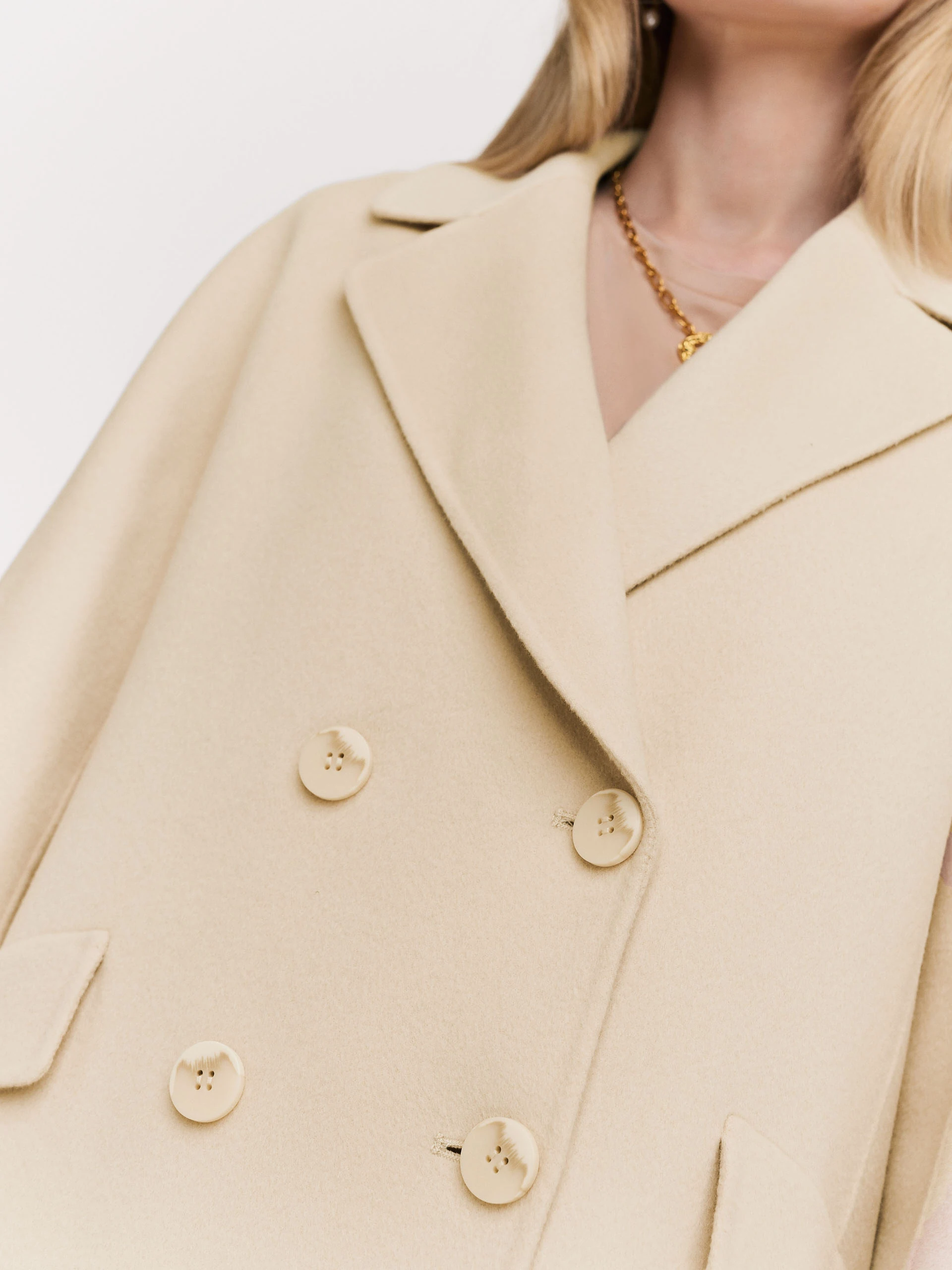 Wool cream coat with a classic cut