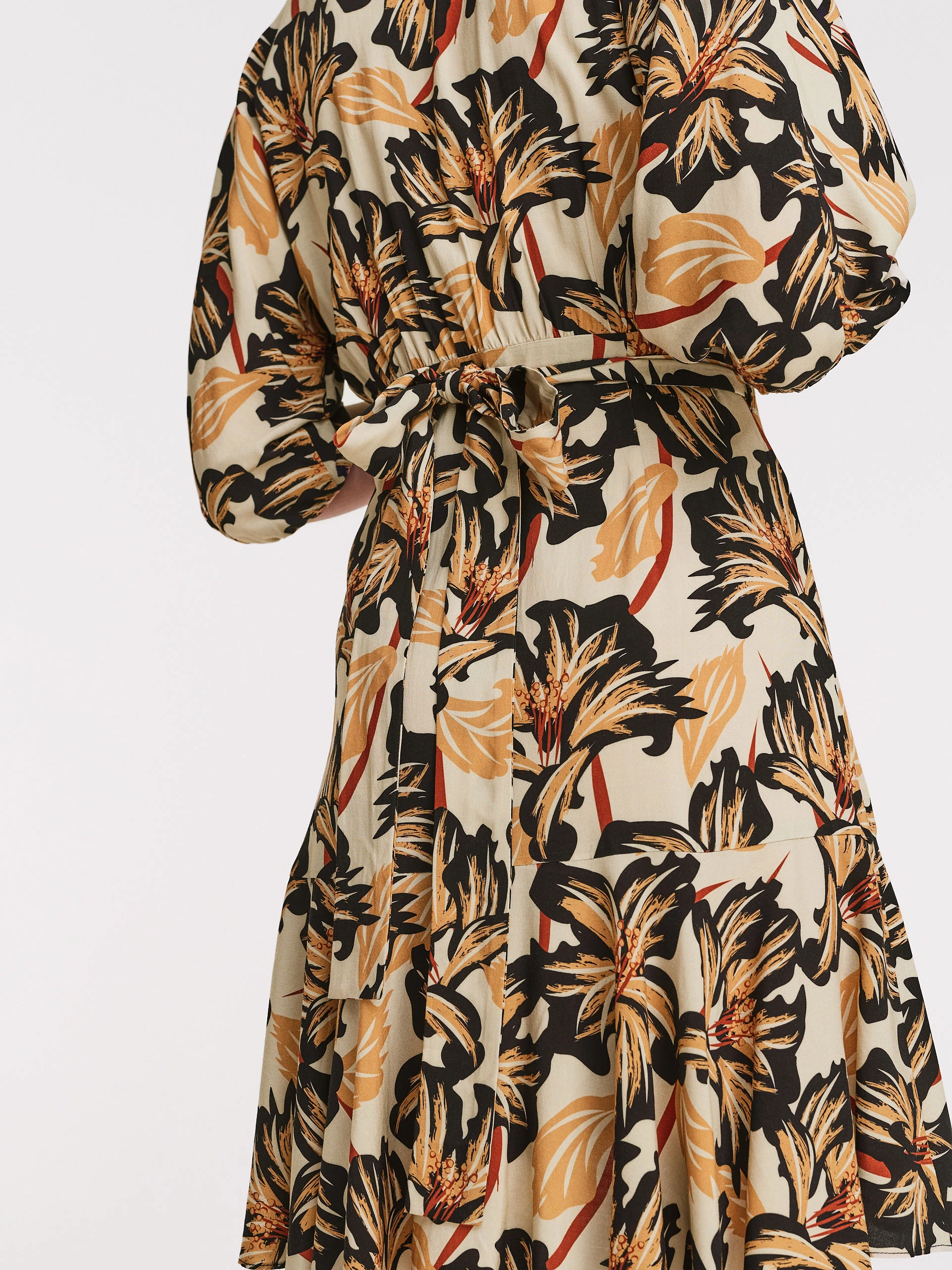 Beige dress with floral patterns
