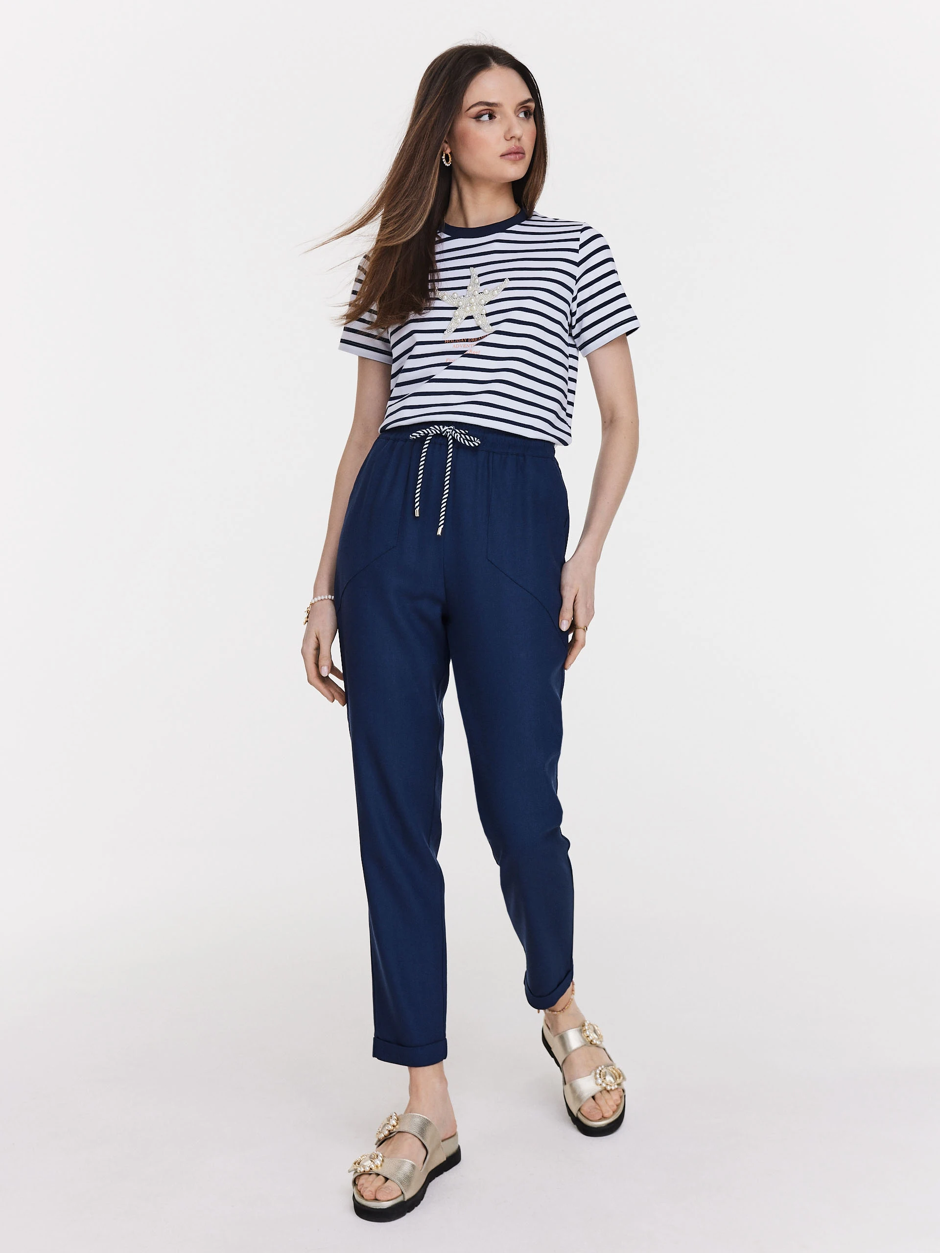 Navy blue pants with rolled up legs