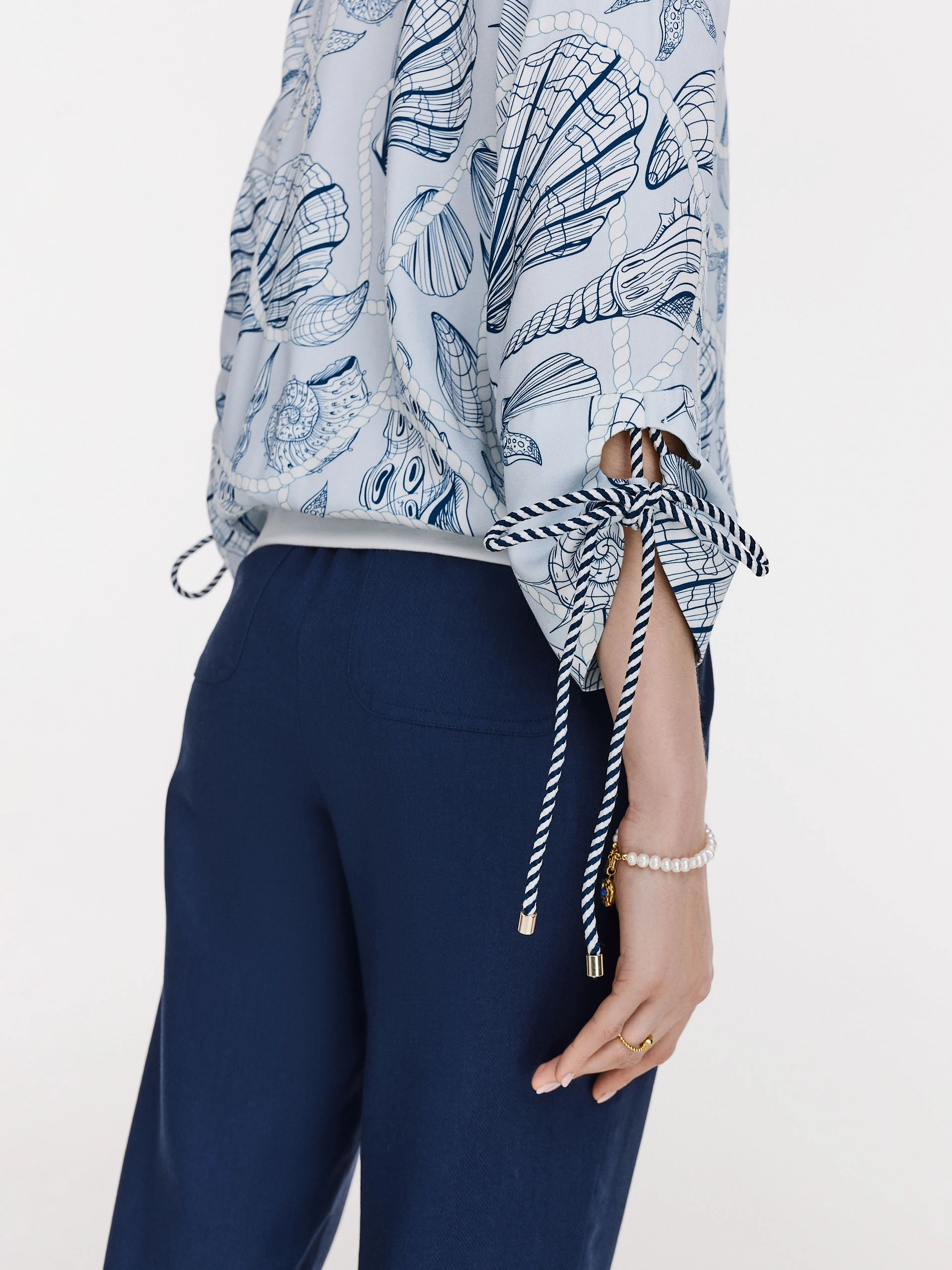 Navy blue pants with rolled up legs