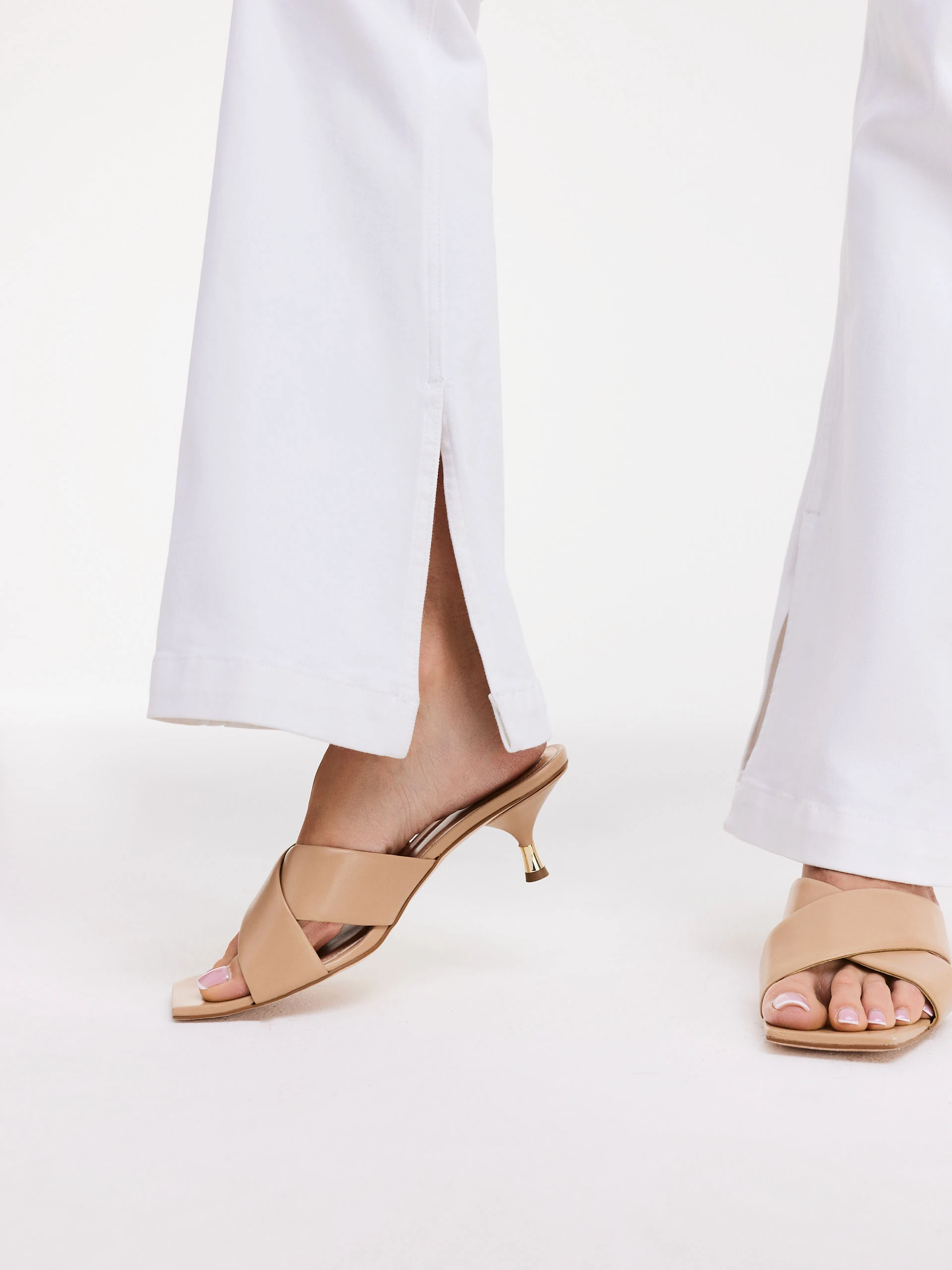 White cotton pants with flared legs
