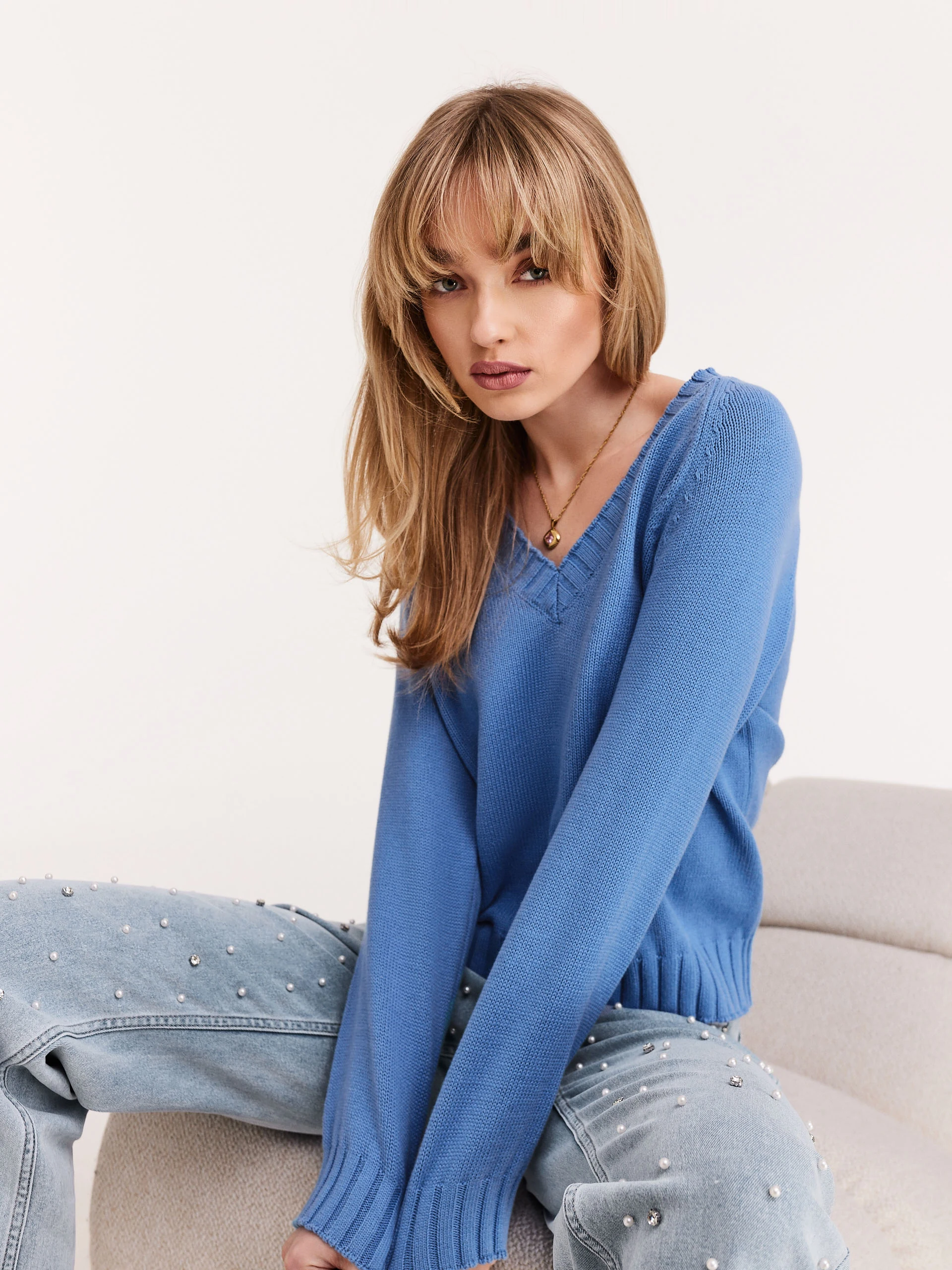 Blue pullover with a v-neck neckline