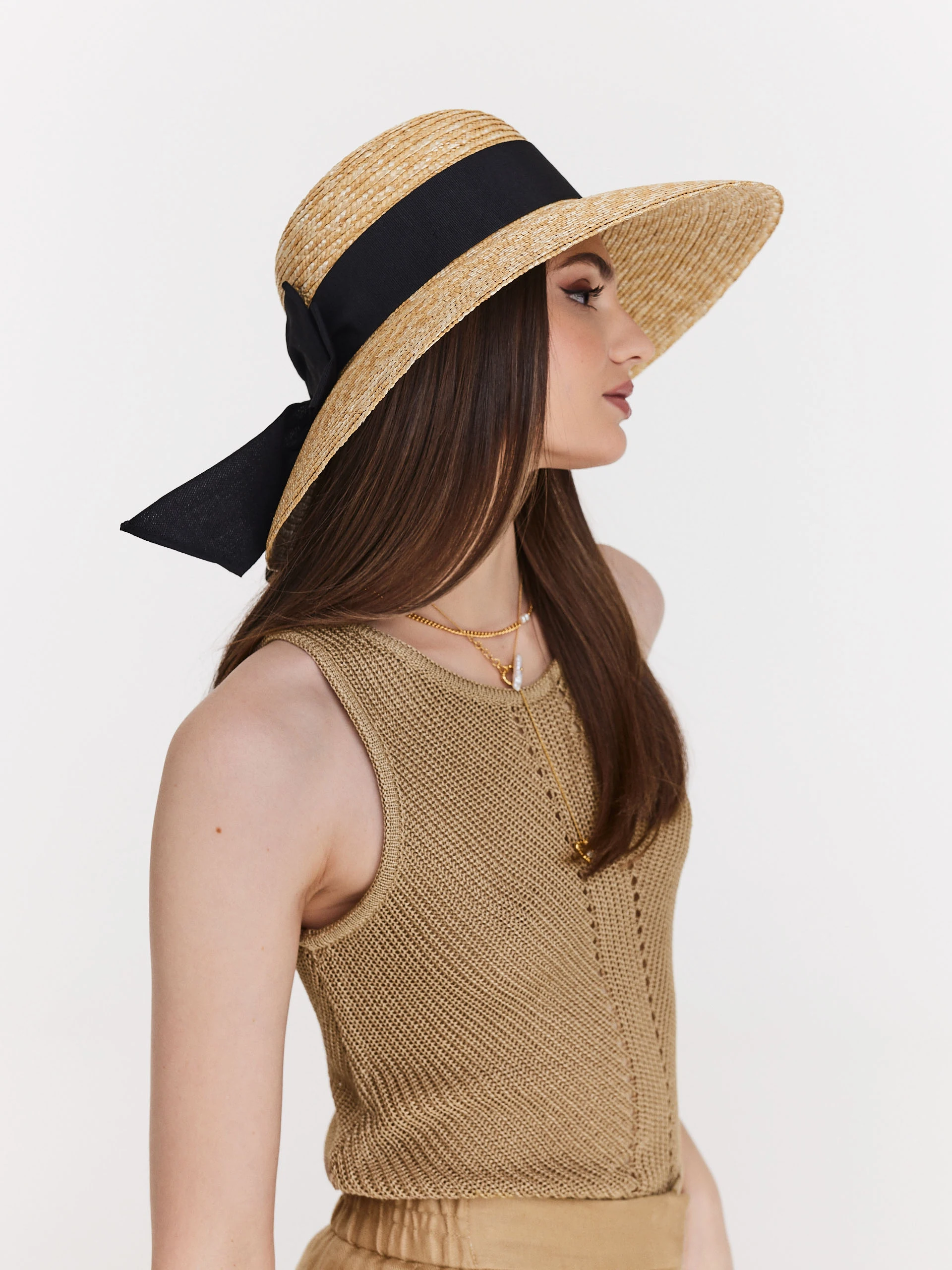 Beige sleeveless openwork sweater