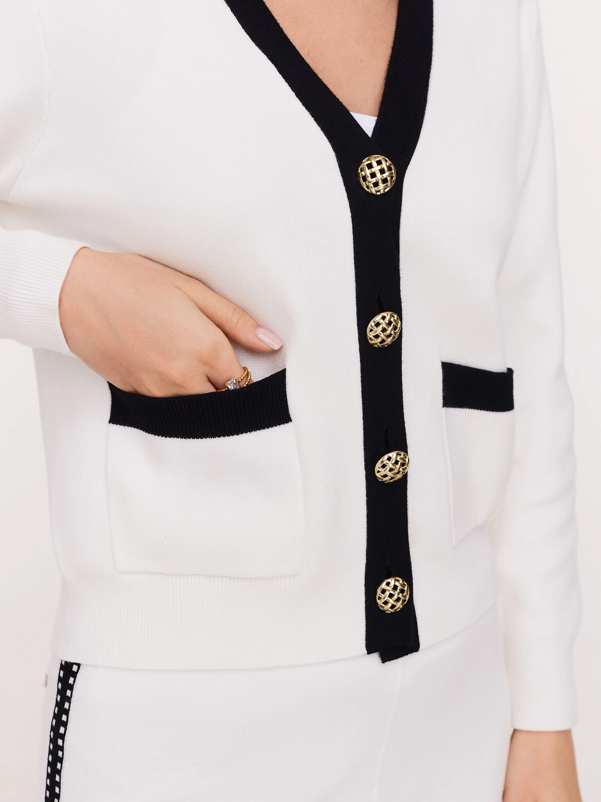 Short cream cardigan with decorative buttons