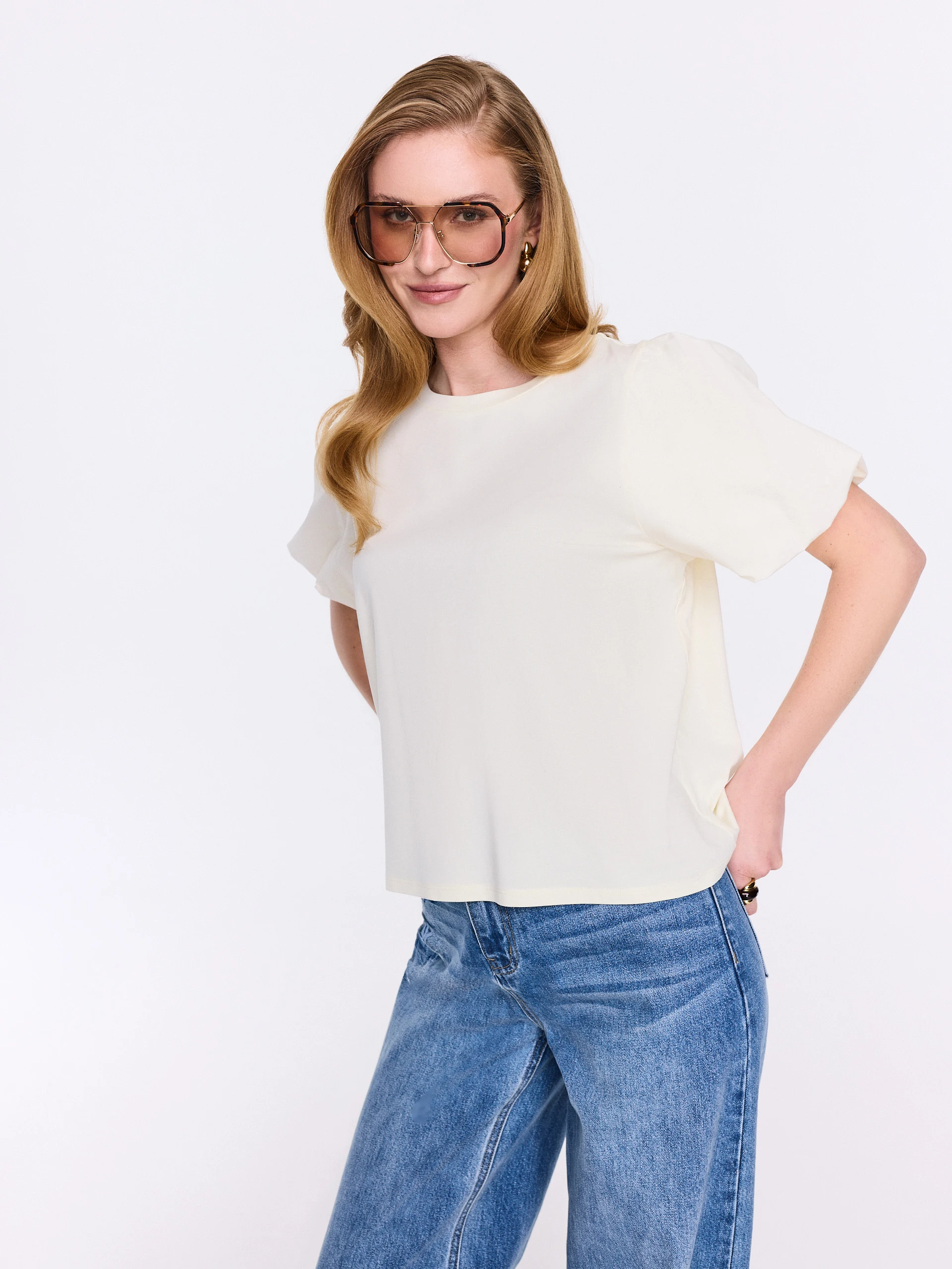 Cream-colored blouse with decorative sleeves