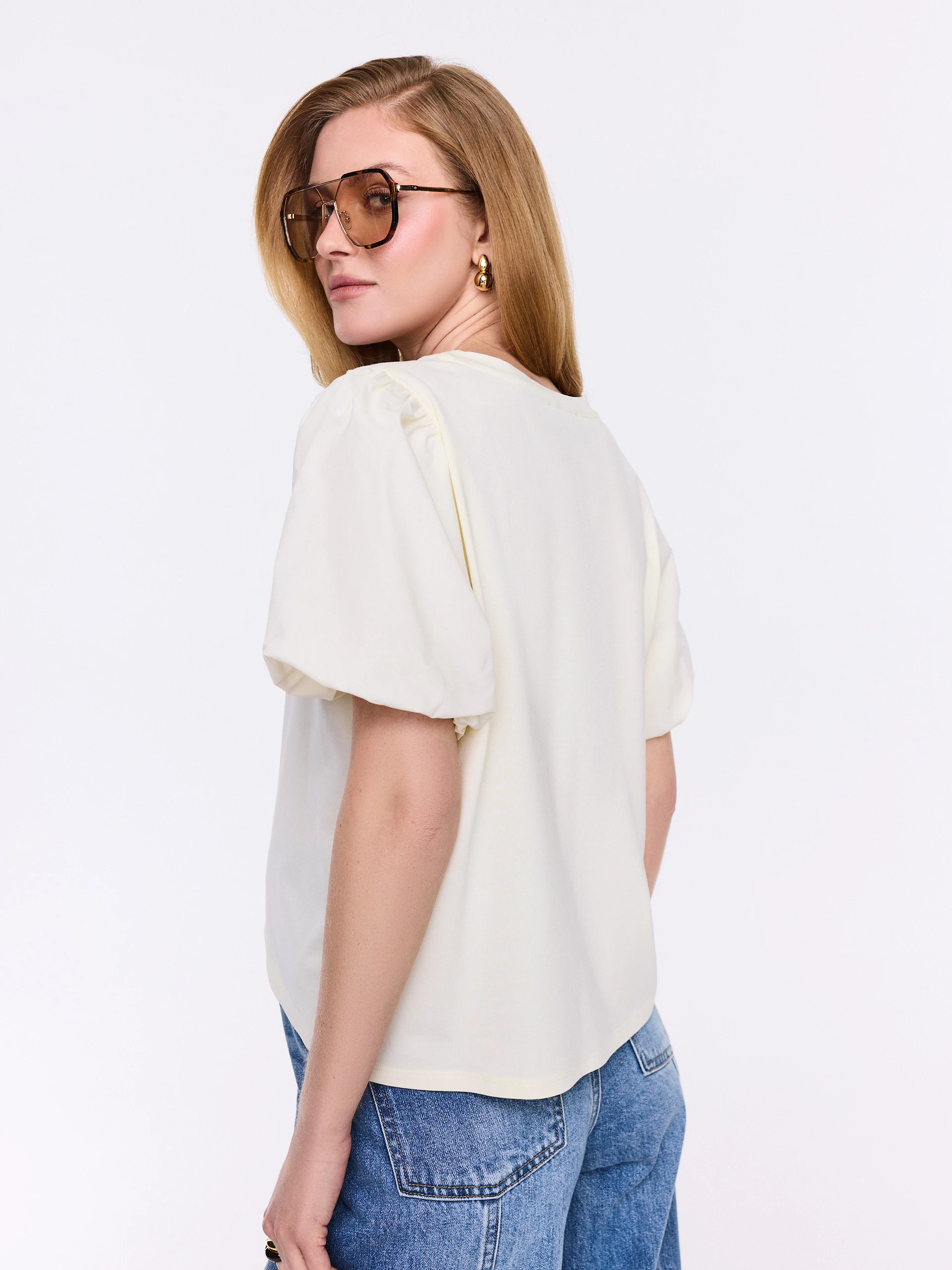 Cream-colored blouse with decorative sleeves