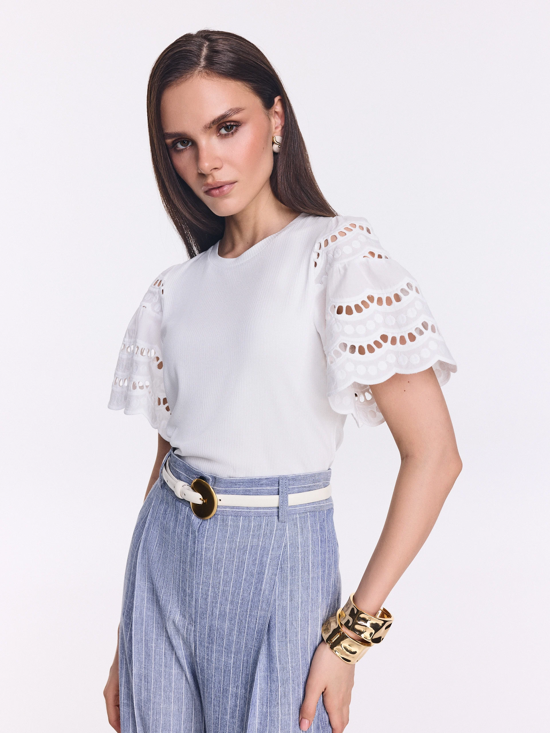 White blouse with openwork puff sleeves