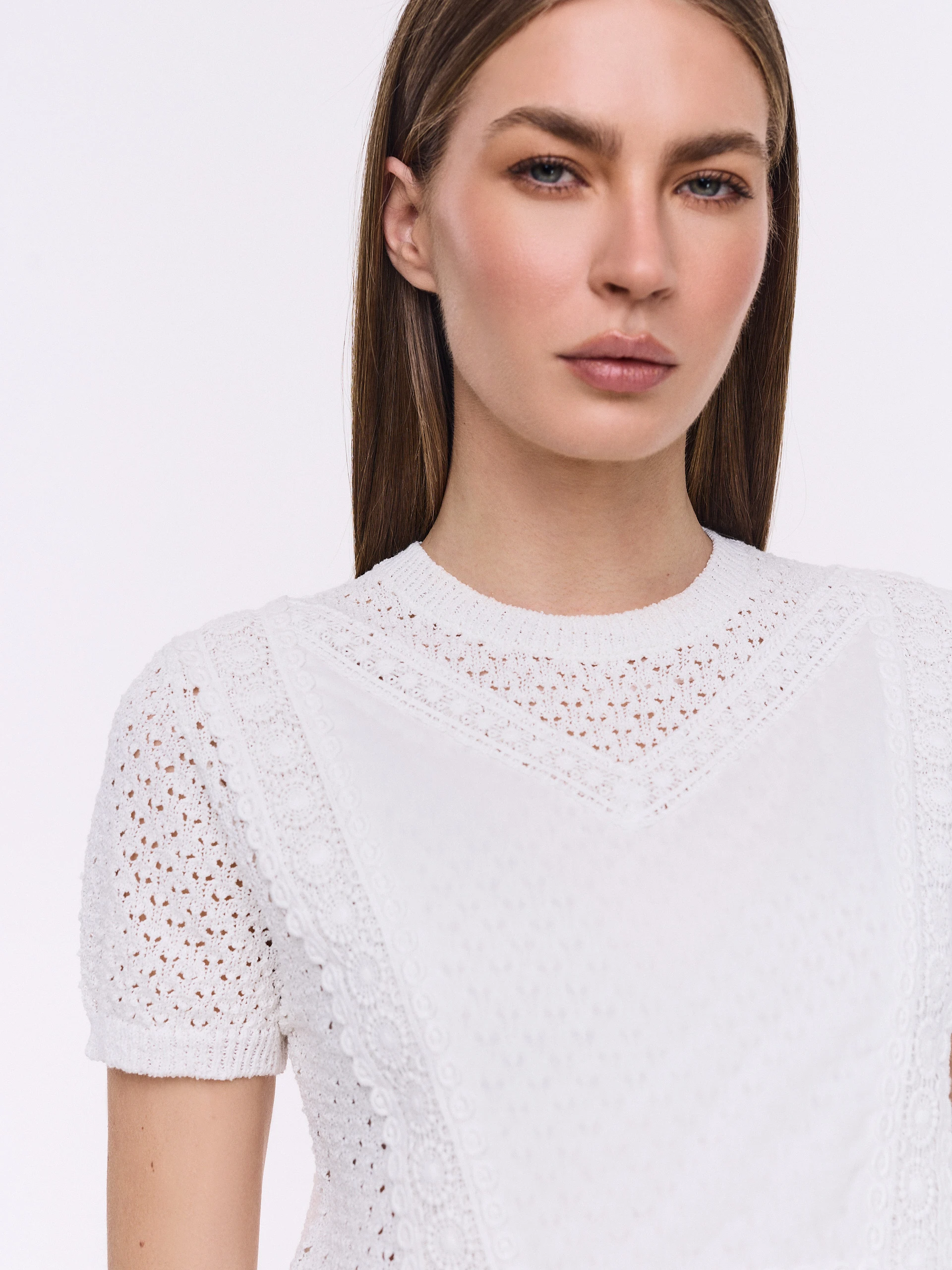 White blouse with peplum and lace details