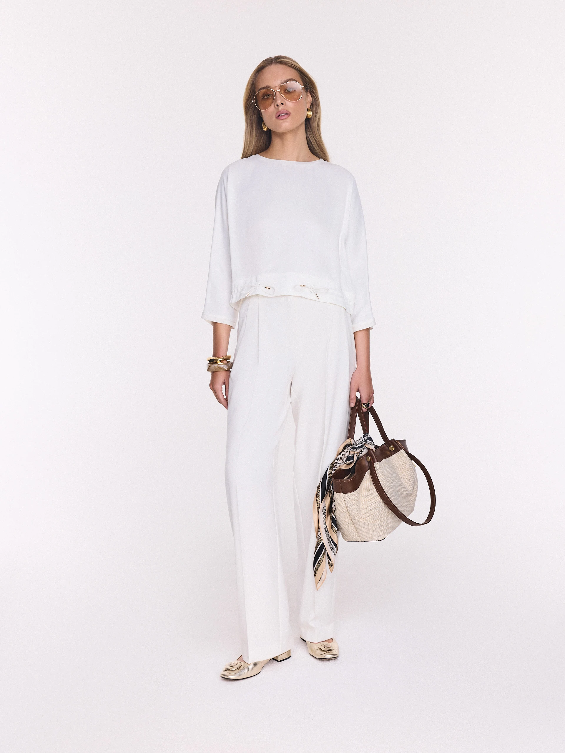 White elegant blouse made of satin viscose