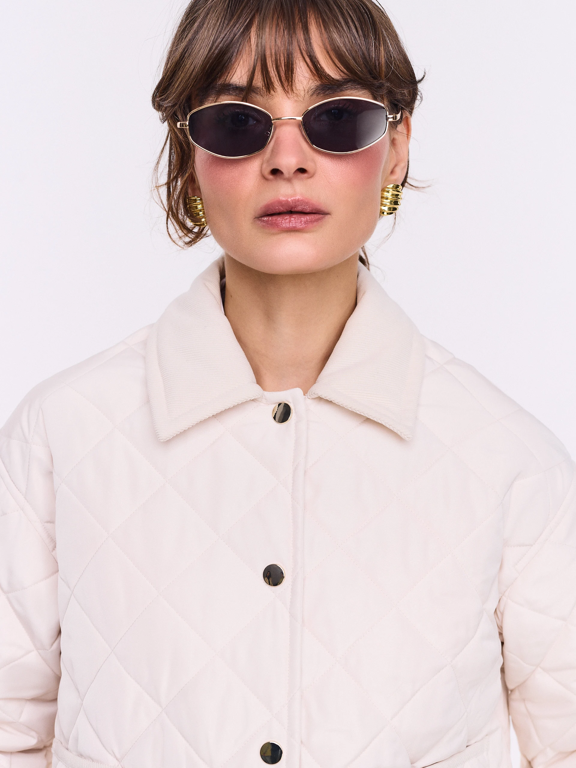 Short quilted jacket in ecru