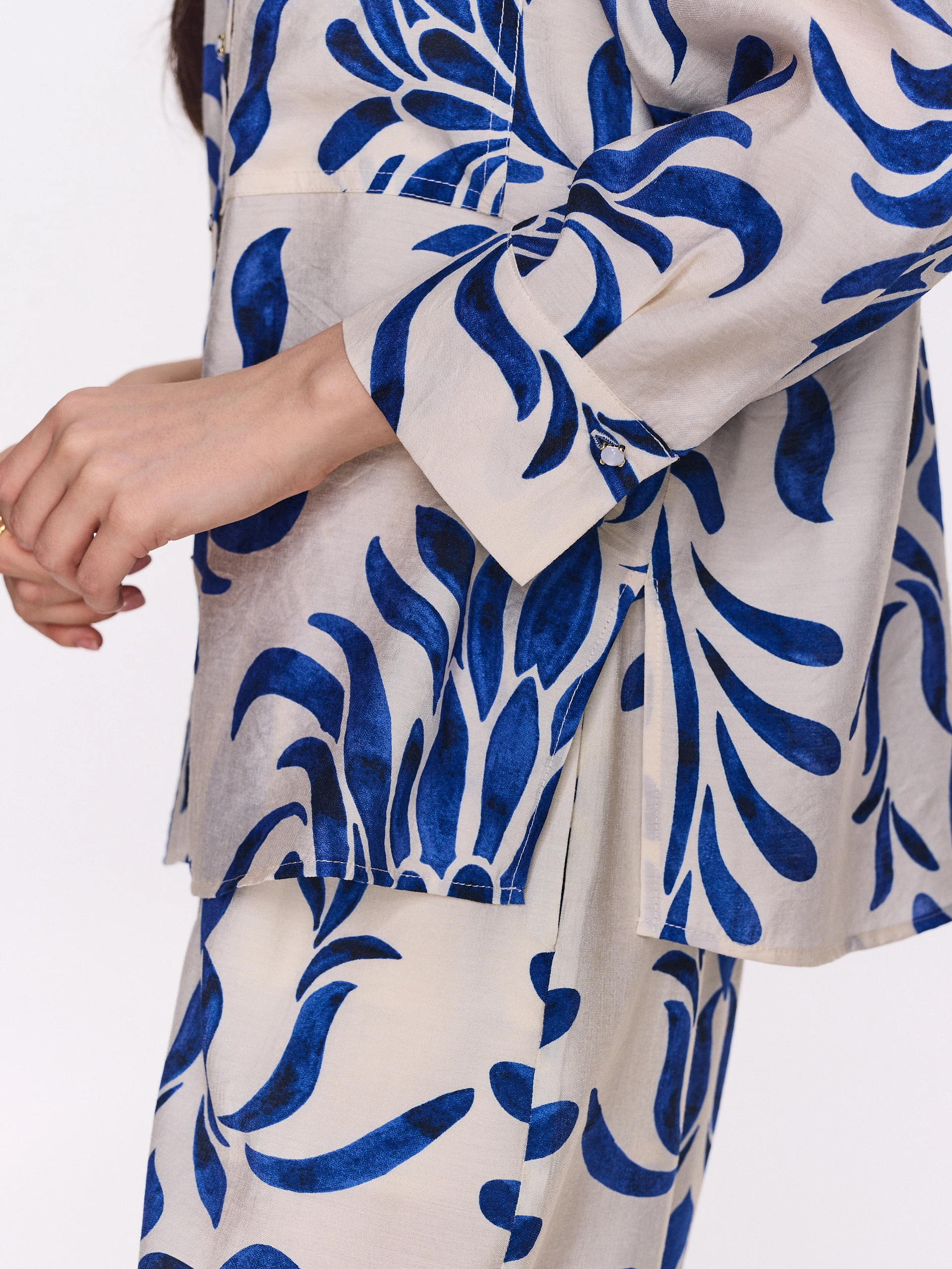 White oversized shirt with an ornamental pattern